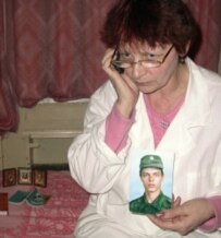 Galina Sychyova, mother of hazing victim Andrei Sychyov, holds a picture of her son (file photo) (ITAR-TASS)