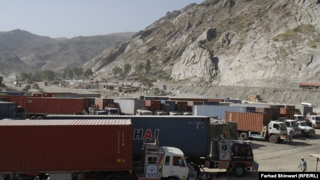A convoy of trucks waits in the Khyber Pass area of the Pakistani-Afghan border on July 4 for word that the crossings are open again.