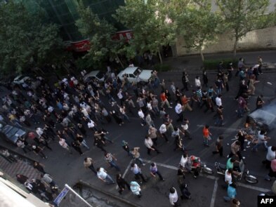 Opposition protestors in the streets of central Tehran weeks after the June election that they dismissed as fraudulent.