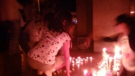 Armenia - Candles are put in a silent vigil otuside the Harsnakar restaurant in Yerevan, 30Jun2012.