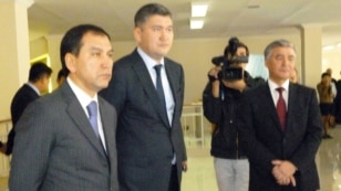 Deputy Education Minister Sayat Shayakhmetov (center) in a public appearance from late April