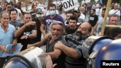 Demonstrators scuffled with the police in the Cypriot capital, Nicosia, in late April after lawmakers approved an EU bailout.