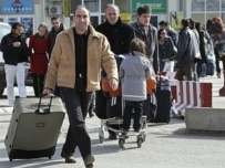 New arrivals at Pristina's international airport on February 11 (AFP)