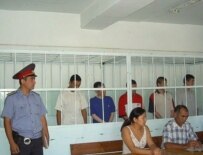 Defendants on trial in Kyrgyzstan in August (RFE/RL)