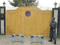 An Afghan police officer stands guard outside Seoul's embassy in Kabul following the kidnapping of 23 South Koreans by the Taliban (file photo) (AFP)