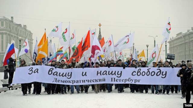 Opposition demonstrators stage a march "For your and our freedom" in central St. Petersburg on December 9.