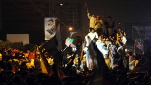 Supporters of Pakistani politician Imran Khan marched on May 13 in protest against alleged vote rigging in the voting in Karachi two days earlier.