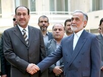 Prime Minister al-Maliki (left) meets with Iranian First Vice President Parviz Davudi in Tehran on August 8 (ISNA)