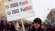 Russian protesters gather in central Moscow with signs for a demonstration for fair elections on February 4.