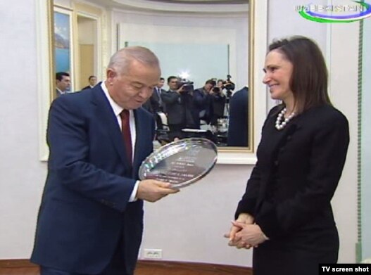 A screen grab of Uzbek President Islam Karimov meeting with the chairman of the  American-Uzbek Chamber of Commerce Carolyn B. Lamm in Tashkent.
