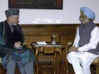 Afghan President Hamid Karzai (left) meets with Indian Prime Minister Manmohan Singh in New Delhi on April 2 (AFP)