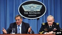 U.S. Defense Secretary Leon Panetta (left) speaks as Chairman of the Joint Chiefs of Staff General Martin Dempsey looks on during a press conference announcing major defense budget cuts in Washington on January 26.