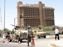 Iraqi forces standing guard outside Al-Mansur hotel after the blast (epa)