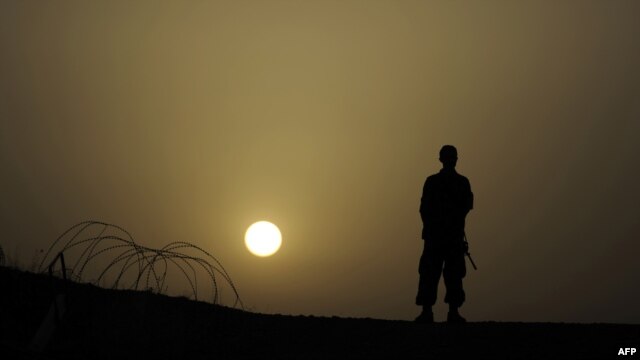 An Afghan soldier stands at a checkpoint in Khost Province. (file photo)