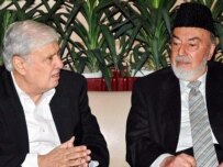 Pakistani Interior Minister Aftab Ahmad Khan Sherpao (left) speaks with an Afghan official in Islamabad in March (epa)