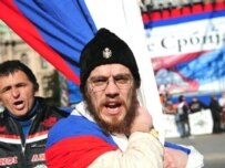 A man wearing an old Serbian military hat shouts slogans before an anti-Kosovo independence rally in Belgrade on February 21 (AFP)