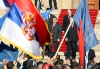 Serbian Prime Minister Vojislav Kostunica (center) with flag-waving supporters outside the parliament building in Belgrade (epa)