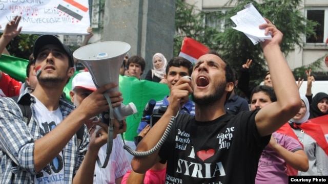 Syrian student Mughira al-Sharif demonstrates against the Assad regime in front of the Syrian Consulate in Istanbul.