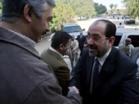 Al-Maliki (right) visiting Baghdad University in November 2006 (epa)