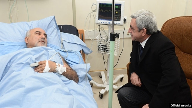 Armenian President Serzh Sarkisian visits wounded opposition presidential candidate Paruyr Hairikian at a Yerevan hospital.
