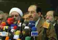 Jawad al-Maiki addresses the press in Baghdad on April 22 (AFP)
