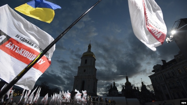 Flags of United Opposition wave above the crowd during their preelection meeting in front of St. Sophia Cathedral in Kyiv on October 26.