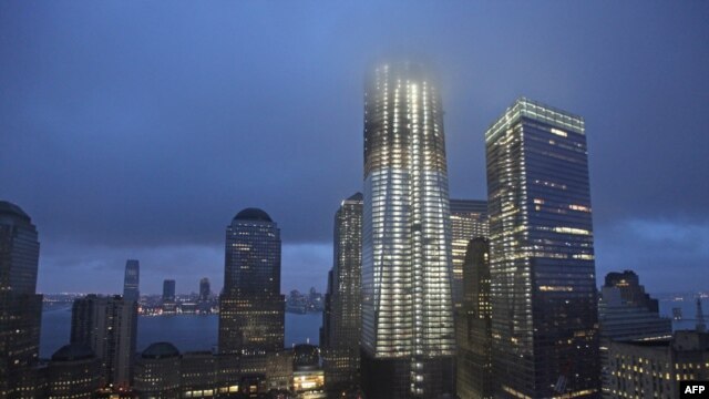Mist shrouds the top of the Freedom Tower, whose final pieces are about to be put in place. 