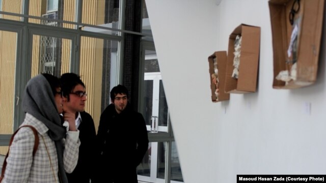 Visitors view Zada's "Memory Box" exhibition at the French Cultural Center in Kabul.