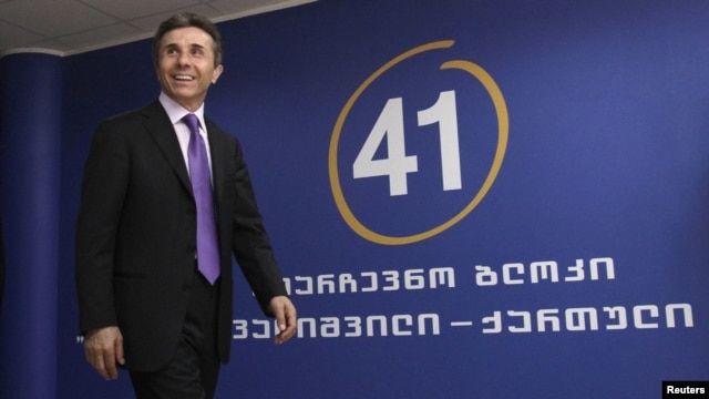 Georgia -- Presidential candidate Bidzina Ivanishvili arrives for a news conference at his office in Tbilisi, 02Oct2012