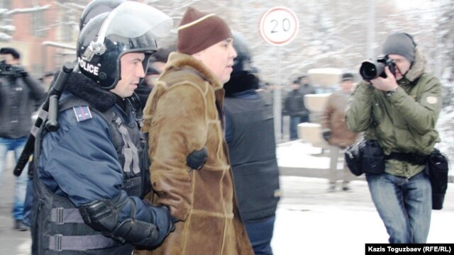 Kazakh police arrest people protesting in the country's main city, Almaty, over the events in Zhanaozen on December 17.