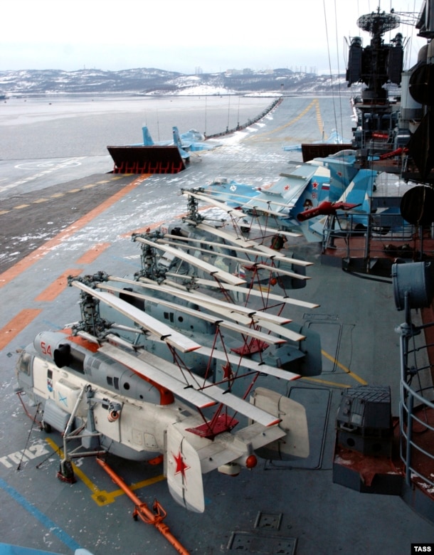 Helicopters and fighter jets on the flight deck of the Admiral Kuznetsov. The carrier is capable of deploying with 52 aircraft aboard. The vessel's air wing, however, is limited by its lack of an aircraft catapult. Most modern aircraft carriers are fitted with a steam-powered catapult that flings aircraft along the deck runway.