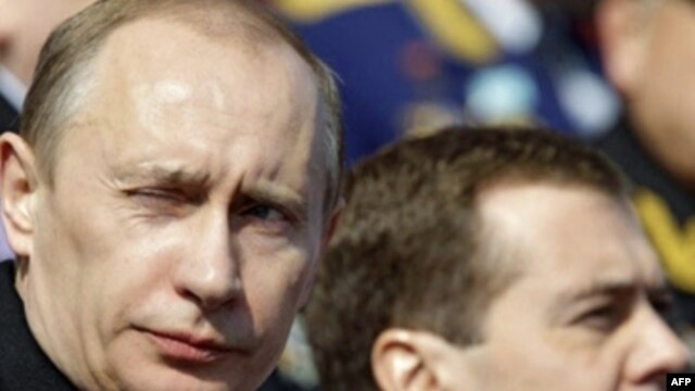 President Dmitry Medvedev (right) and Prime Minister Vladimir Putin