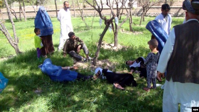 Schoolgirls in Takhar Province receive first aid after the suspected poisoning of their water supply.