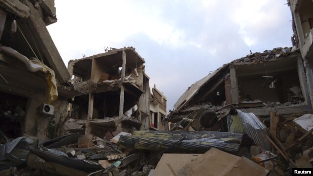 Buildings damaged by what activists said were missiles fired by a Syrian Air Force fighter jet loyal to President Bashar al-Assad in Daraya, near Damascus. (file photo)