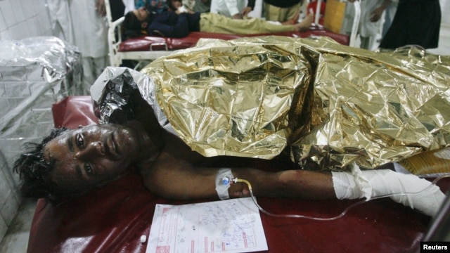 A man injured in the bomb blast in Nowshera awaits treatment at a hospital in Peshawar.