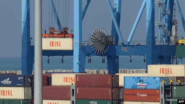 The logo of the Islamic Republic of Iran Shipping Lines mark containers being lifted from a ship in the Israeli port of Ashdod in November 2009.