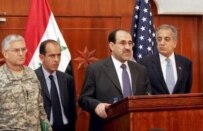 Iraqi Prime Minister Nuri al-Maliki (center) announcing  the killing of al-Zarqawi in Baghdad today (epa)