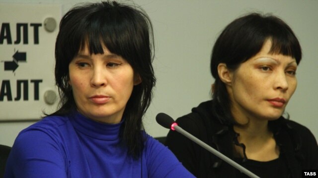 Bakiya Kasymova (left) and Leila Ashirova, both recently freed from captivity, talk to reporters in connection with a recent "slavery" scandal involving migrant workers in Moscow.