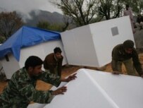 Global Village Shelters being set up in an earthquake-struck region of Pakistan in 2006 (courtesy photo)