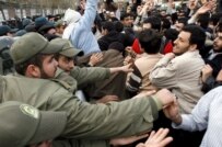 Iranian police battle with student Basij protestors in front of the British Embassy in Tehran today (epa)