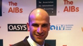 A very happy Farshid Manafi with his AIB award in London.