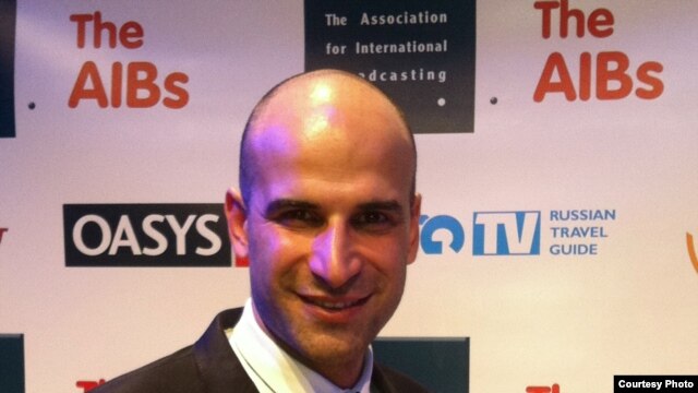 A very happy Farshid Manafi with his AIB award in London.
