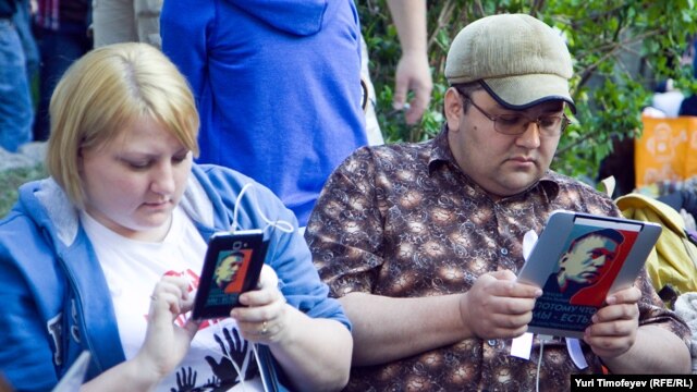 Opposition activists take part in a protest in central Moscow in May.