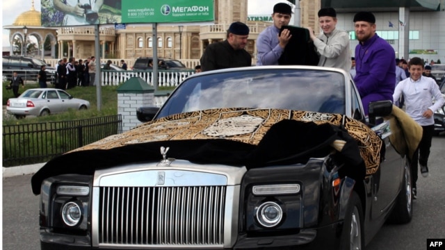 Chechen leader Ramzan Kadyrov (right) escorts the Prophet Muhammad's purported chalice and carpets from the airport to Grozny's central mosque in September.