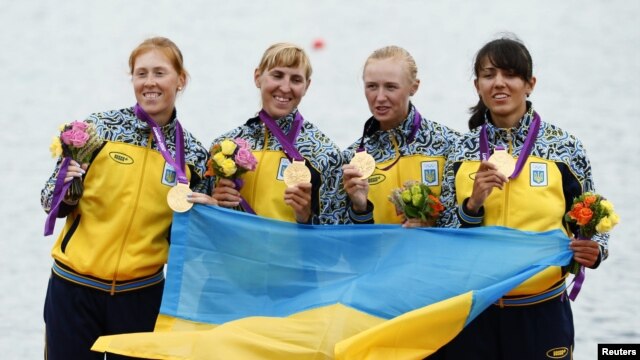 Gold medallists (left to right) Kateryna Tarasenko, Yana Dementieva, Anastasiia Kozhenkova, and Nataliya Dovgodko of Ukraine pose during the victory ceremony after the women's quadruple sculls Final A at Eton Dorney during the London Games on August 1.