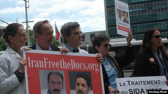 Protesters at the United Nations participate in one of the global vigils held for Arash and Kamiar Alaei.