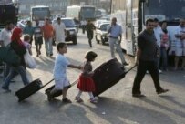 Lebanese refugees crossing into Syria on July 17 (epa)