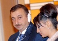 Azerabaijani President Aliyev pictured with his wife in Japan on March 8 (epa)