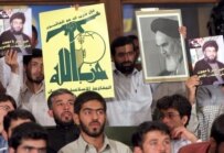 Iranian students show their support for Hizballah leader Hassan Nasrallah at rally in Tehran on July 30 (epa)