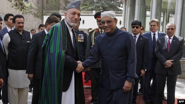 Afghan President Hamid Karzai and his Pakistani counterpart, Asif Zardari, were trying to overcome mutual distrust on the first day of talks in Istanbul.